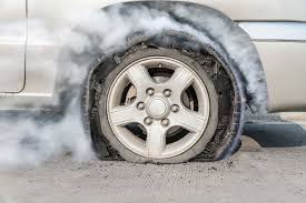 a car tire with smoke coming out of it