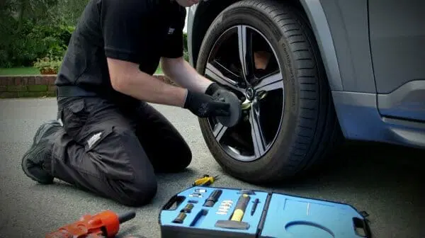 a man working on a tire