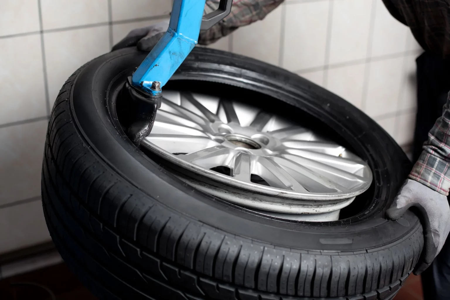 a person holding a tire